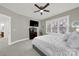 Bedroom features gray walls, natural light, ceiling fan, and TV at 431 Third Baxter St, Fort Mill, SC 29708
