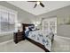 Cozy bedroom with gray walls, a ceiling fan, and two windows, creating a serene atmosphere at 431 Third Baxter St, Fort Mill, SC 29708