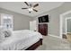This bedroom features a ceiling fan, hardwood floors, and ensuite bathroom at 431 Third Baxter St, Fort Mill, SC 29708