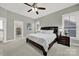 This bedroom has a ceiling fan and a walk-in closet with custom shelving at 431 Third Baxter St, Fort Mill, SC 29708
