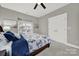 Bedroom with carpet, ceiling fan, natural light, and white closet doors at 431 Third Baxter St, Fort Mill, SC 29708