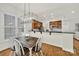 This dining area is next to the kitchen, with a chandelier and hardwood floors at 431 Third Baxter St, Fort Mill, SC 29708