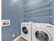 This laundry room features shelving and full size washer and dryer at 431 Third Baxter St, Fort Mill, SC 29708