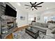 Comfortable living room with stone fireplace and hardwood floors, open to dining and kitchen at 431 Third Baxter St, Fort Mill, SC 29708
