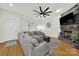 Spacious living room with stone fireplace, hardwood floors, and comfortable seating at 431 Third Baxter St, Fort Mill, SC 29708