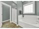 This bathroom features a soaking tub with shower and tile floors at 431 Third Baxter St, Fort Mill, SC 29708
