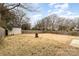 Expansive backyard with wooden fence, shed, and ample space for outdoor activities at 4815 Carriage Drive Cir, Charlotte, NC 28205