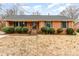 Charming brick home with well-maintained front yard and inviting entryway at 4815 Carriage Drive Cir, Charlotte, NC 28205