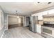 Bright kitchen with stainless steel appliances and adjacent dining area at 4815 Carriage Drive Cir, Charlotte, NC 28205