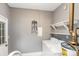Functional laundry room with washer, dryer, and shelving for organized storage solutions at 4815 Carriage Drive Cir, Charlotte, NC 28205