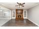 Welcoming living room with cozy brick fireplace and wood flooring at 4815 Carriage Drive Cir, Charlotte, NC 28205