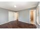 Main bedroom with a neutral color scheme and an attached bathroom at 4815 Carriage Drive Cir, Charlotte, NC 28205
