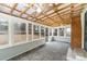 Bright sun room with brick flooring, ceiling fans and lots of natural light at 4815 Carriage Drive Cir, Charlotte, NC 28205