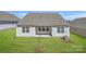View of the house from the backyard showcasing the well-maintained lawn at 5944 Oak Branch Cir, Maiden, NC 28650