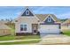 Charming single-story home with blue and gray siding, a two-car garage, and a well-manicured lawn at 5944 Oak Branch Cir, Maiden, NC 28650