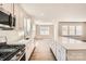Modern kitchen with stainless steel appliances, a subway tile backsplash, and a large center island at 5944 Oak Branch Cir, Maiden, NC 28650