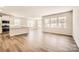 Bright and airy living room featuring hardwood floors and multiple windows for plenty of natural light at 5944 Oak Branch Cir, Maiden, NC 28650