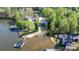 Breathtaking aerial view of the property with a private dock and lush surroundings on the waterfront at 6233 Riviera Run Estates Dr, Hickory, NC 28601