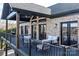 Relaxing outdoor back porch with black railing and overlooking the water at 6233 Riviera Run Estates Dr, Hickory, NC 28601