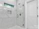 Bathroom with marble tiles in the shower and white door at 6233 Riviera Run Estates Dr, Hickory, NC 28601