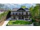 Rear exterior of home with patios, lake views, and manicured lawn at 6233 Riviera Run Estates Dr, Hickory, NC 28601