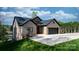 Lovely home showcasing a brick exterior, well-manicured lawn, and a spacious driveway leading to a two-car garage at 6233 Riviera Run Estates Dr, Hickory, NC 28601