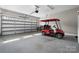 Spacious garage with large roll-up door and an electric golf cart at 6233 Riviera Run Estates Dr, Hickory, NC 28601