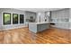 Modern kitchen with a large center island, stainless steel appliances, and hardwood flooring at 6233 Riviera Run Estates Dr, Hickory, NC 28601
