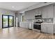Gray kitchen with stainless steel appliances, white countertops, and access to the outdoor deck at 6233 Riviera Run Estates Dr, Hickory, NC 28601
