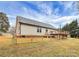 Exterior view of a home with fenced backyard, deck, and lush green lawn at 642 Brynwood Dr, Rock Hill, SC 29732