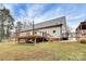 Back exterior of home highlighting spacious deck, patio, fenced yard, and landscaped areas at 642 Brynwood Dr, Rock Hill, SC 29732
