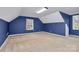 A spacious bonus room is illuminated by a large window and features fresh paint and carpet at 642 Brynwood Dr, Rock Hill, SC 29732
