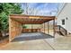 Attached carport with gravel flooring next to the entrance of the house at 642 Brynwood Dr, Rock Hill, SC 29732