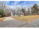 Spacious property featuring a driveway, carport, well-kept lawn, and a charming home with inviting curb appeal at 642 Brynwood Dr, Rock Hill, SC 29732