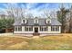 Charming Cape Cod home featuring dormer windows, black shutters, and a well-manicured lawn at 642 Brynwood Dr, Rock Hill, SC 29732