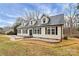 Charming home featuring black shutters, a well-maintained lawn, and ample natural light through the windows at 642 Brynwood Dr, Rock Hill, SC 29732
