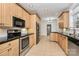 Kitchen showcasing stainless steel appliances, granite countertops, and wood cabinetry at 642 Brynwood Dr, Rock Hill, SC 29732
