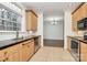 Bright kitchen showcasing stainless steel appliances, wooden cabinets, and tile flooring at 642 Brynwood Dr, Rock Hill, SC 29732