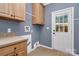 Functional laundry room featuring upper cabinets and a utility sink at 642 Brynwood Dr, Rock Hill, SC 29732
