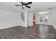 Spacious living room featuring hardwood floors, a ceiling fan and an open floor plan at 642 Brynwood Dr, Rock Hill, SC 29732
