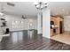 Open-concept living room with hardwood floors, a ceiling fan, and an adjacent kitchen at 642 Brynwood Dr, Rock Hill, SC 29732