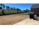 Large backyard with a built-in grill and a grassy hill in the background at 7711 Bainbridge Rd, Sherrills Ford, NC 28673