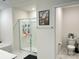 Bathroom featuring a glass-enclosed shower, bathtub, and a view to the toilet area at 7711 Bainbridge Rd, Sherrills Ford, NC 28673