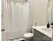 Cozy bathroom with shower, tub, vanity, and a black patterned rug at 7711 Bainbridge Rd, Sherrills Ford, NC 28673