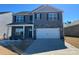 Beautiful two-story home with stone accents, a two-car garage, and a well-maintained lawn at 7711 Bainbridge Rd, Sherrills Ford, NC 28673