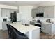 Modern kitchen featuring gray cabinets, stainless steel appliances, and a large center island at 7711 Bainbridge Rd, Sherrills Ford, NC 28673