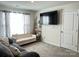 Relaxing living room with comfortable seating, a large TV, and stylish decor at 7711 Bainbridge Rd, Sherrills Ford, NC 28673