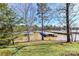 Lush lawn slopes down to a lake with boat docks, creating a private backyard oasis at 84 Ridgeport Rd # B, Clover, SC 29710