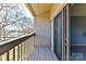 Relaxing outdoor balcony overlooking calm lake waters with sliding glass doors at 84 Ridgeport Rd # B, Clover, SC 29710
