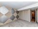 Bedroom with large closets and decorative accent wall and neutral carpeting at 84 Ridgeport Rd # B, Clover, SC 29710